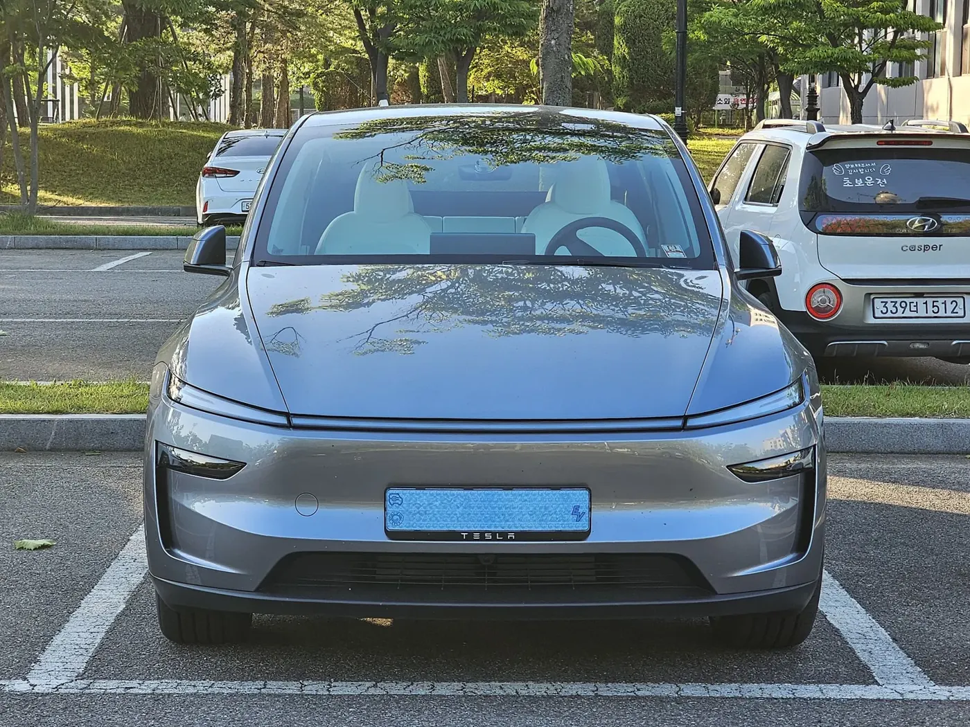 Silver Tesla Model Y (current generation), front view