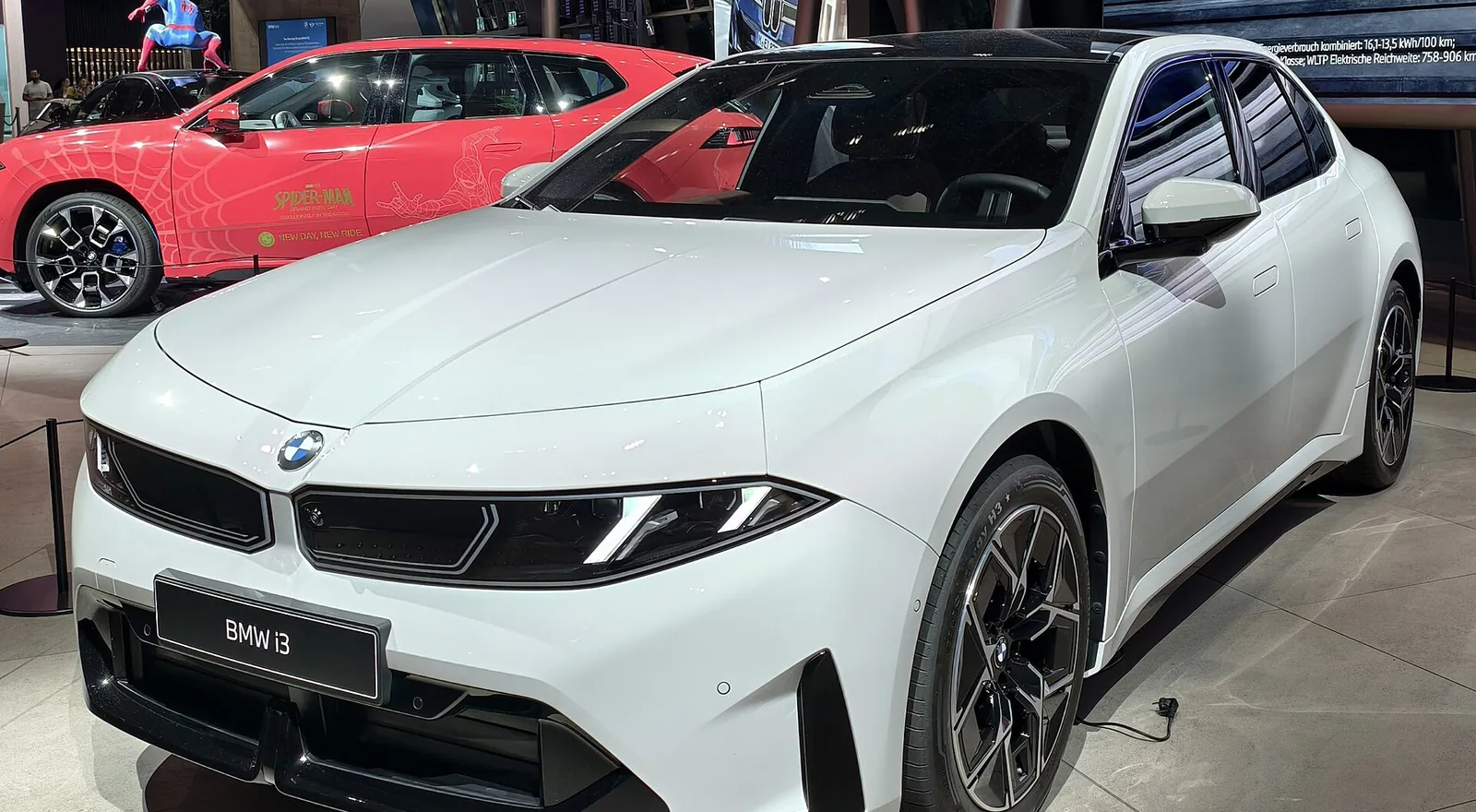 White BMW i3 50 xDrive electric sedan (Neue Klasse, NA0) on display, front three-quarter view