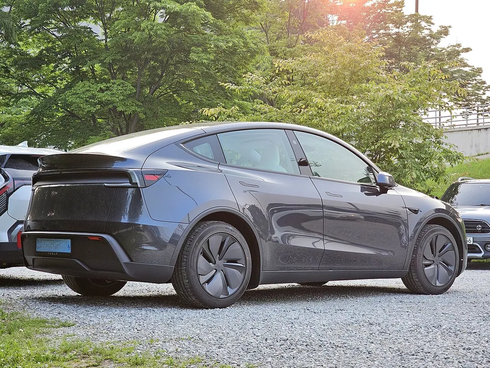 Grey updated Tesla Model Y, side view